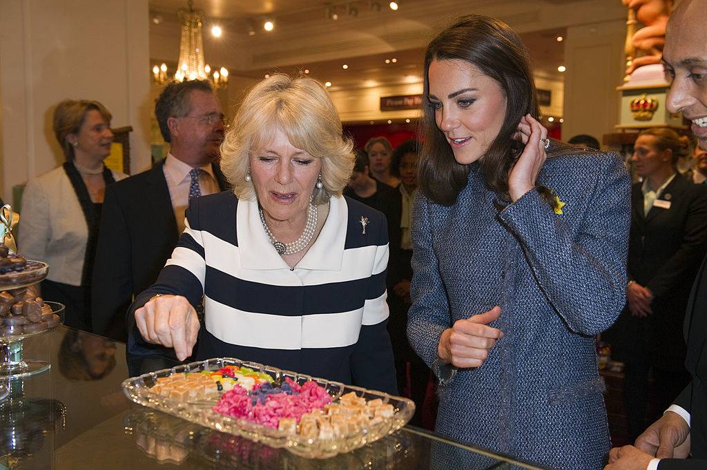 kate and camilla eating small treats