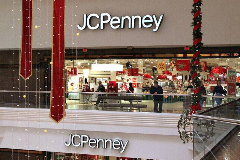 jc penney 1655992 Holiday decorations hang near an entrance to the JC Penney store