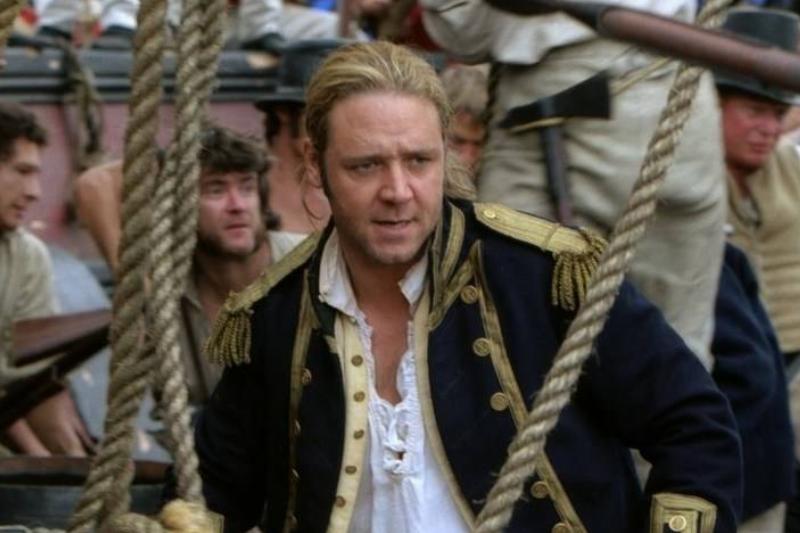 master-and-commander-the-far-side-of-the-world_233a14d3 Russel Crowe bracing on ship as Captain Jack Aubrey in Master And Commander:The Far Side Of The World