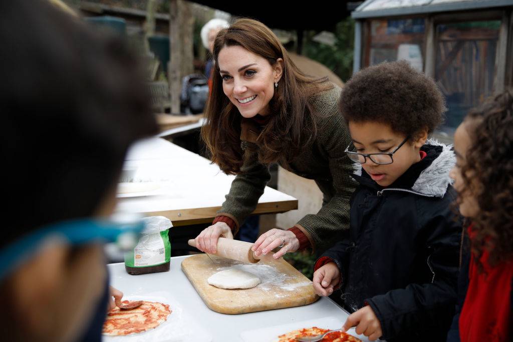 kate rolling dough with children