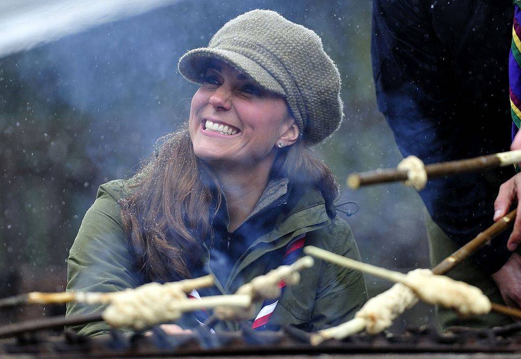kate middleton cooking food over a fire