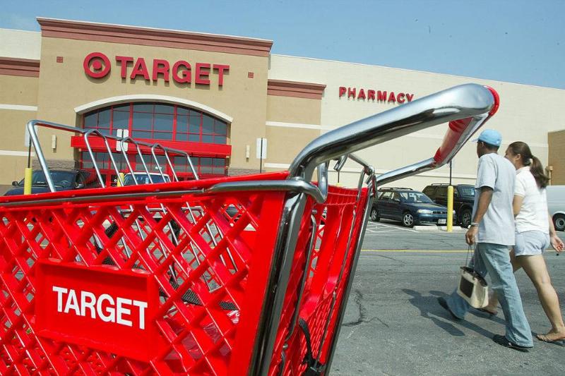 target 2400629 Customers walk outside a Target store