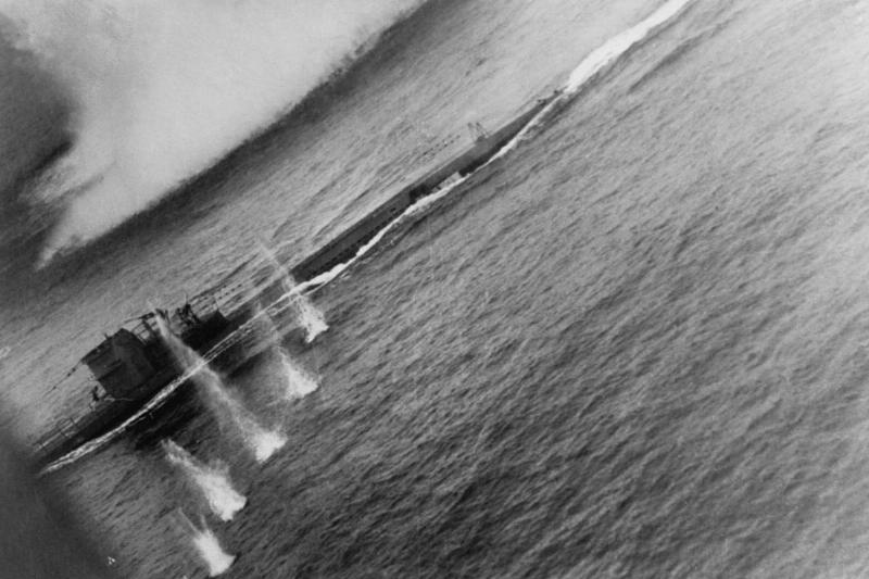 A series of small eruptions in the water show the path of an air attack  on German Submarine U-134. John T. Hitchcock piloted the VP-201