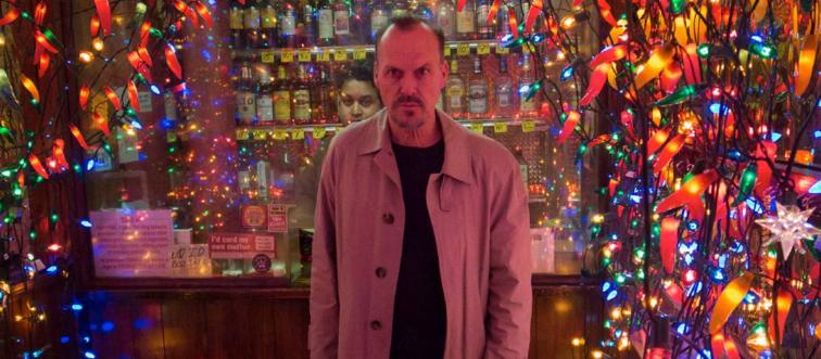 Michael Keaton standing among colored lights as Riggan Thomson in Birdman