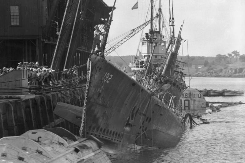 Portsmouth, N. H.: Squalus Back From The Deep. The U.S. Submarine  Squalus, to salvage which 500 men of the U.S. Navy have labored for 113 
days, is shown at her pier in Portsmouth Navy Yard today as water was 
pumped from her flooded compartments preparatory to the grim task of 
removing her 26 dead.
