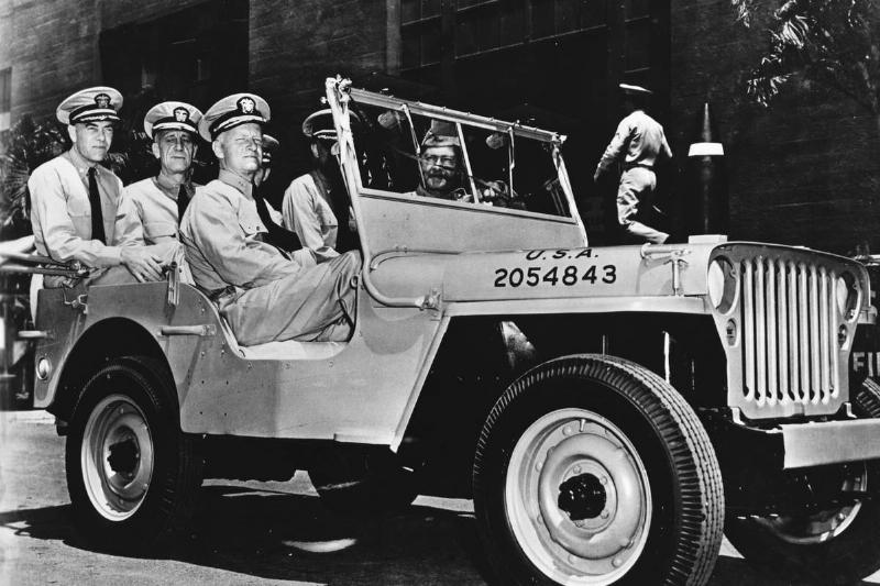 Admiral Chester William Nimitz (c), the Commander-in-Chief of the US  Pacific Fleet, takes a ride around Pearl Harbor with his aides-de-camp 
in a jeep presented to the fleet by the US Army in honour of their naval
 victory at Midway Island.