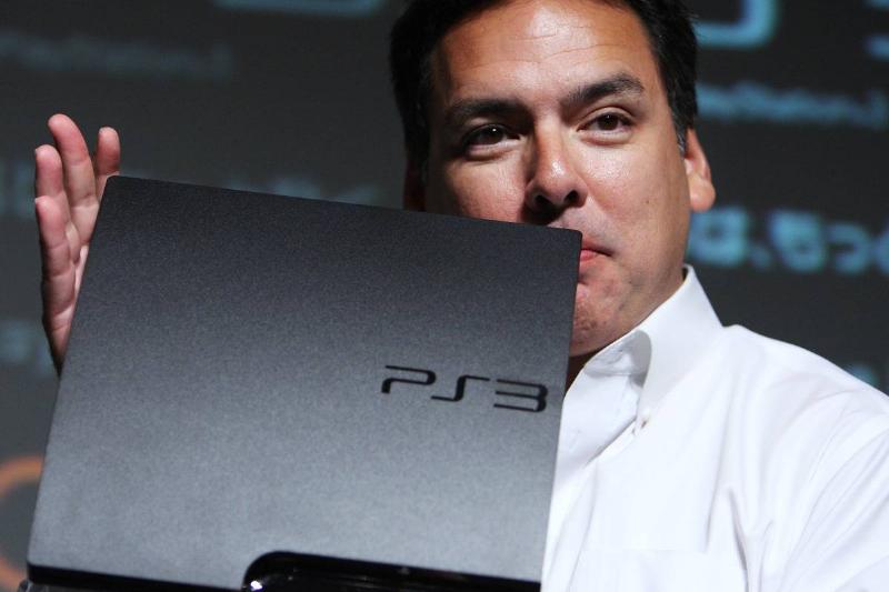 Shawn Layden, head of Japan at Sony Computer Entertainment Inc., shows  off the company's new, slimmer version of the Sony PlayStation 3 
video-game console during a news conference in Tokyo, Japan, on 
Wednesday, Aug. 19, 2009.