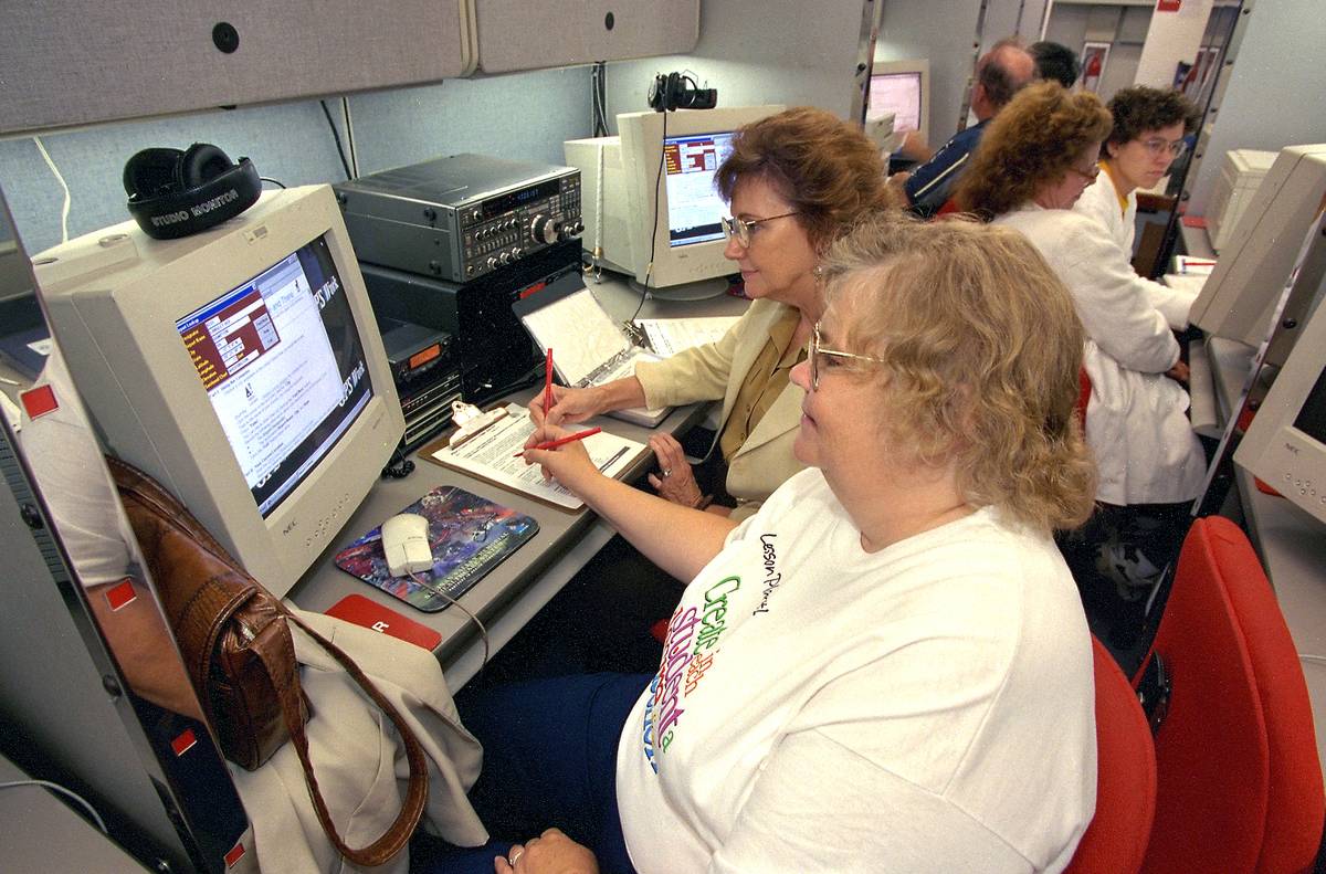 Teacher workshop in late 1990s with teachers working on 20th century computers