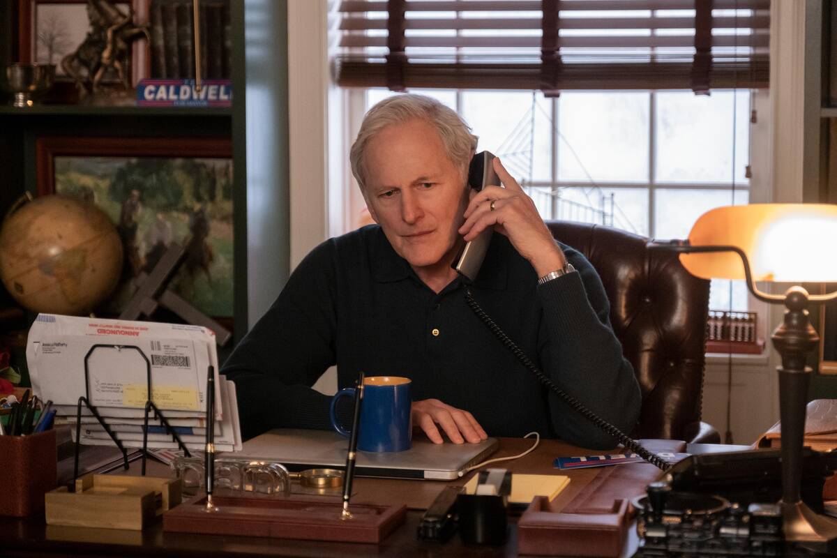 Victor Garber sternly talking on phone as Ted in Happiest Season