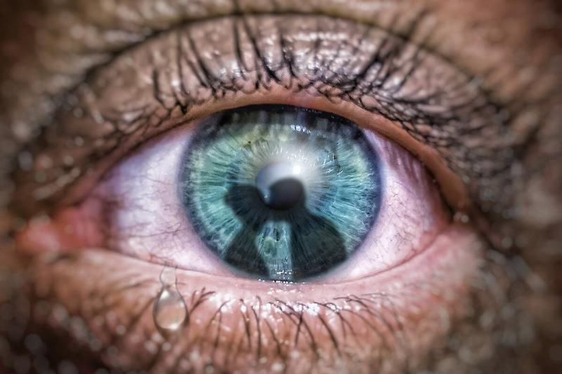 eye crying at seeing couple kiss