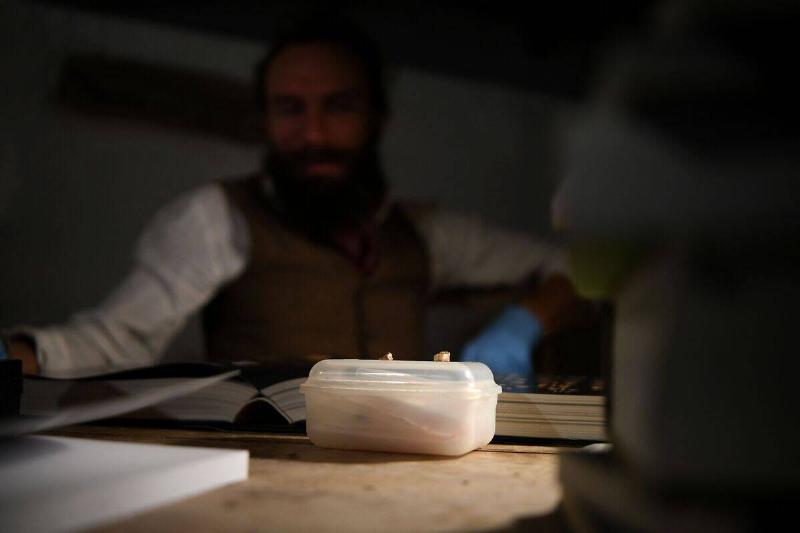 Ludovic Slimak, French National Centre for Scientific Research (CNRS)  researcher and archaeologist of the University of Toulouse, poses with 
the milk teeth of a Homo Sapiens and a Neanderthal at his home in 
Saint-Laurent-sur-Save, southwestern France, on February 11, 2022.