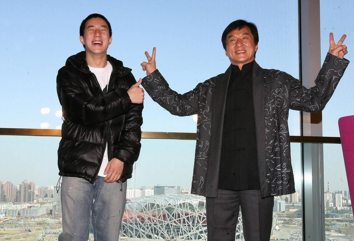 Hong Kong entertainer Jackie Chan (R) po
