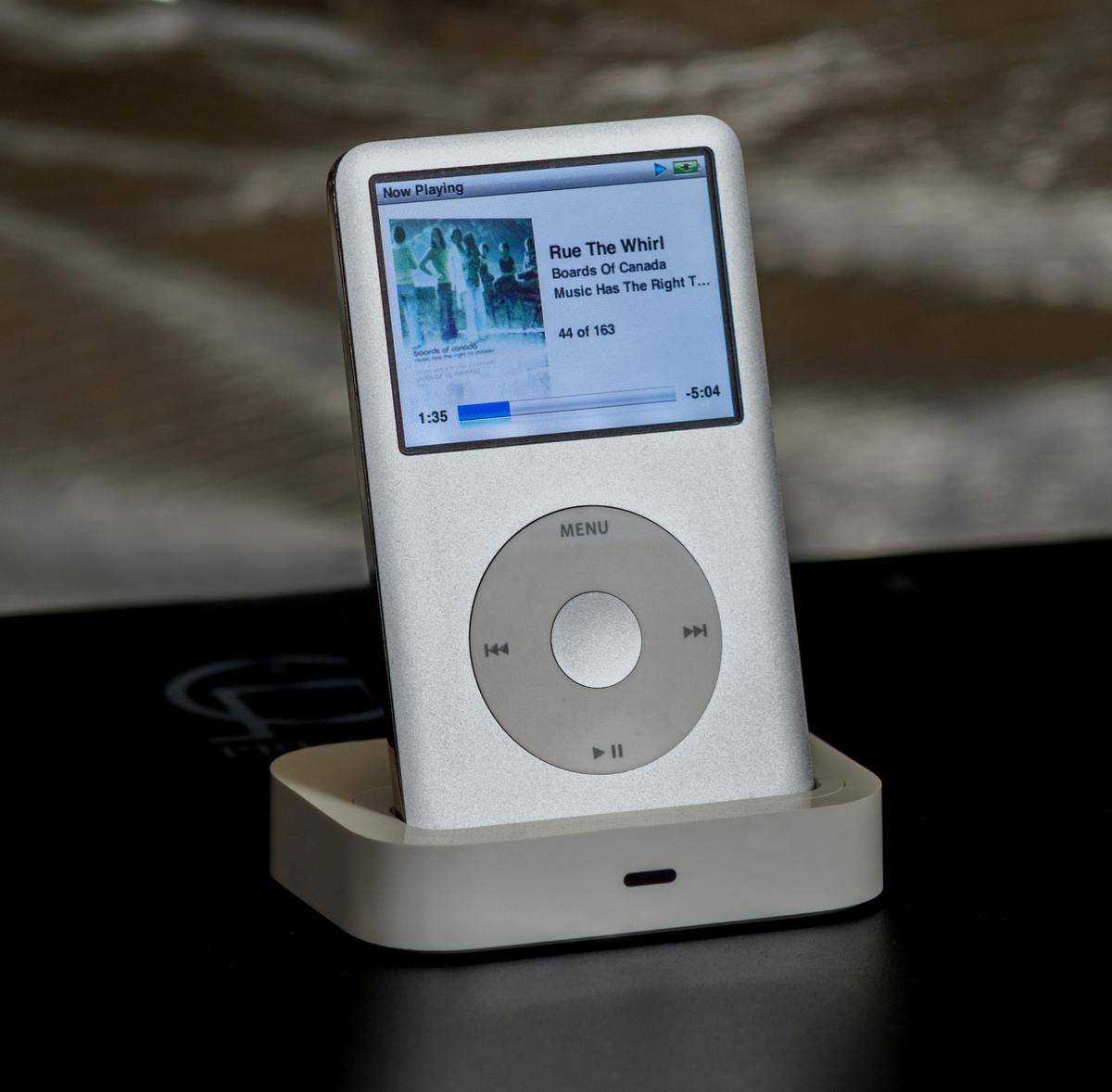 iPod Classic in a docking station playing Rue the Whirl by Boards of Canada