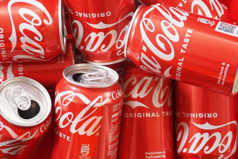 In this photo illustration, empty Coca-Cola cans seen...