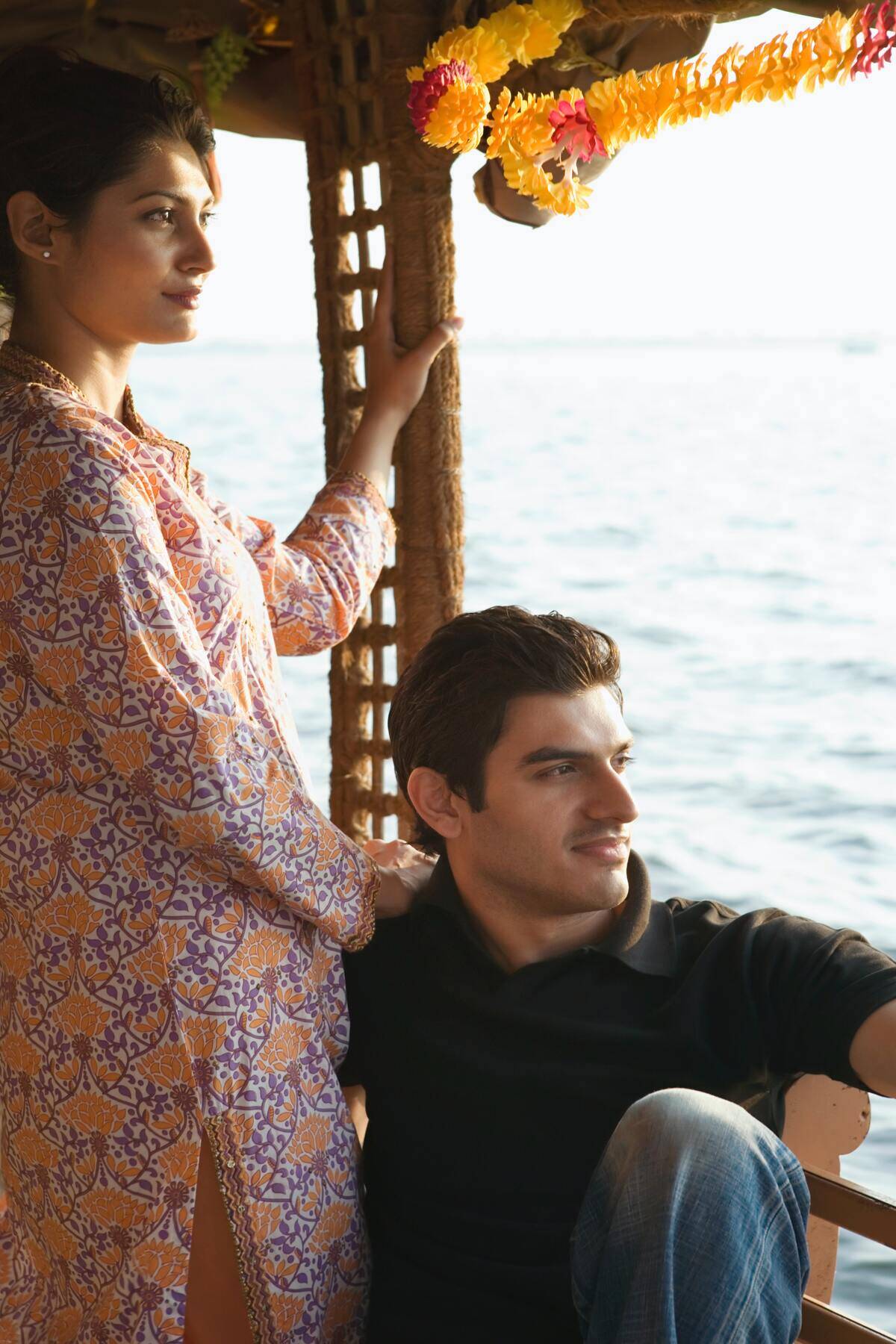 man and woman looking self-satisfied on boat