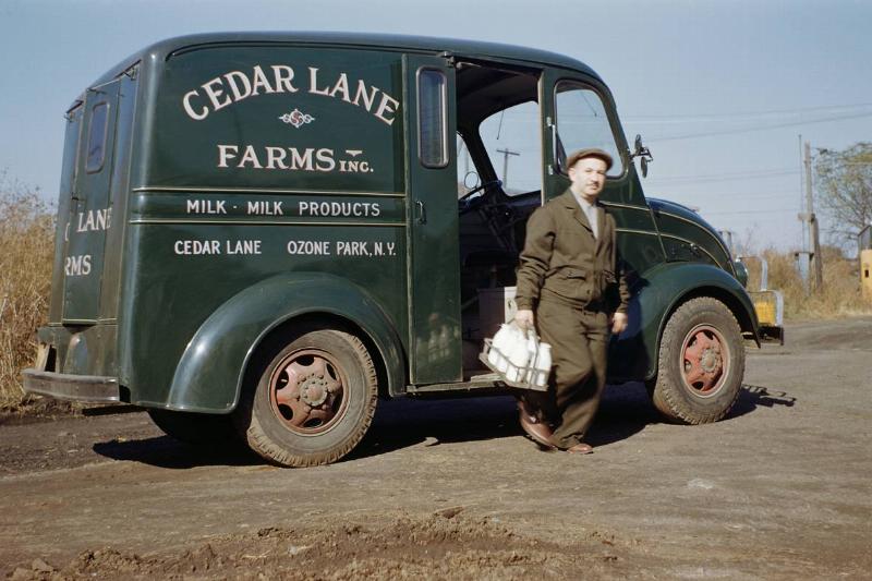 Milkman Stepping out of Milk Truck