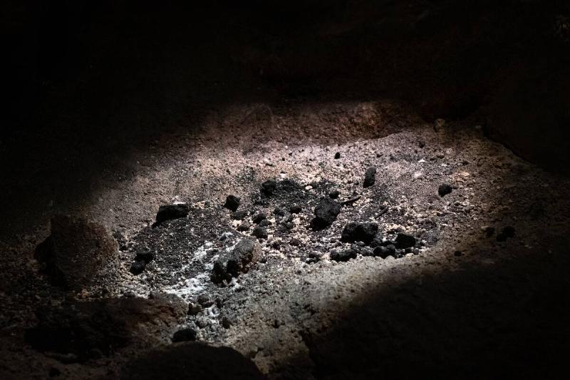 The vestiges of a fire made by prehistoric men are seen in...