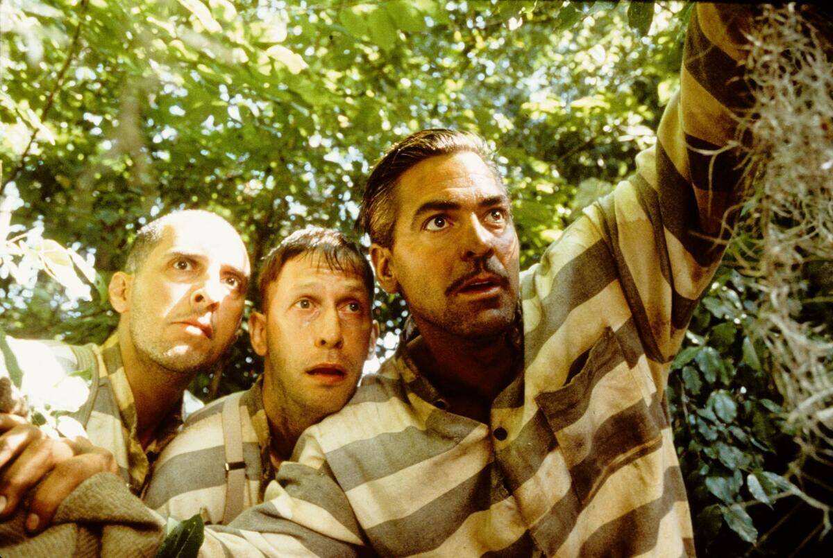 George Clooney, John Turturro and tim Blake Nelson as Ulysses Everett mcGill, Pete Hogwallop and Delmar O'Donnel in O Brother Where Art Thou