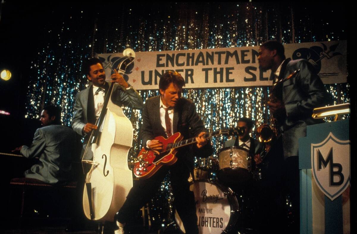 Michael J. Fox playing guitar as Marty McFly in Back To The Future