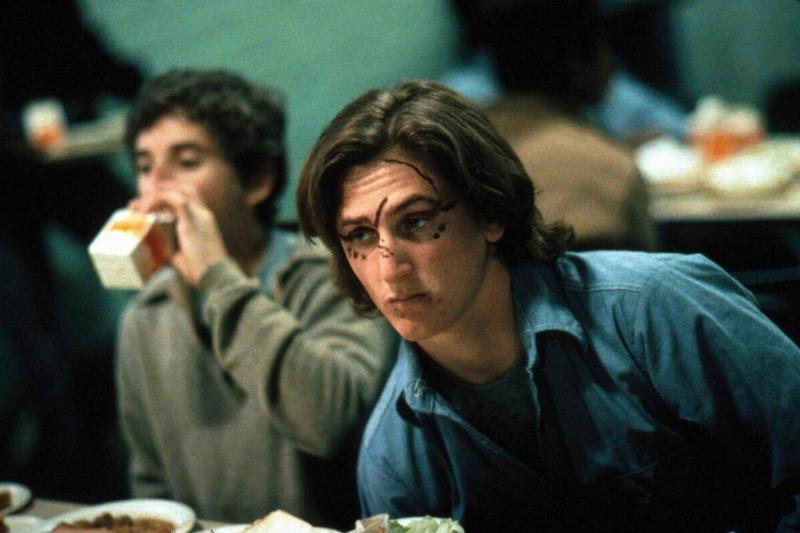 Senn Penn as Mick O'Brien sitting next to Eric Gurry drinking milk as Horowitz in Bad Boys