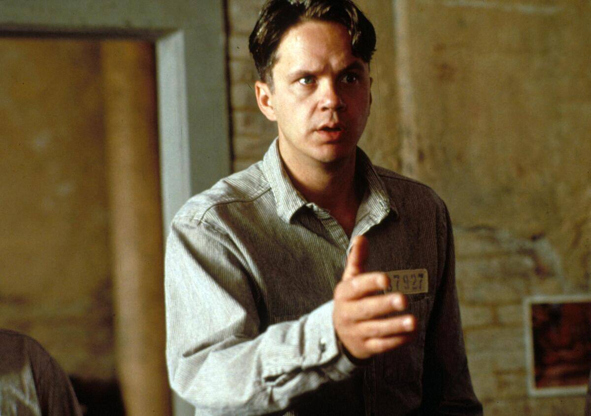 Tim Robbins extending hand as Andy Dufresne in The Shawshank Redemption