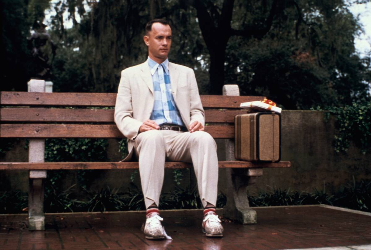 Tom Hanks sitting on bench as Forrest Gump