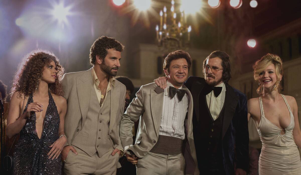 actors in 70s clothes in american hustle