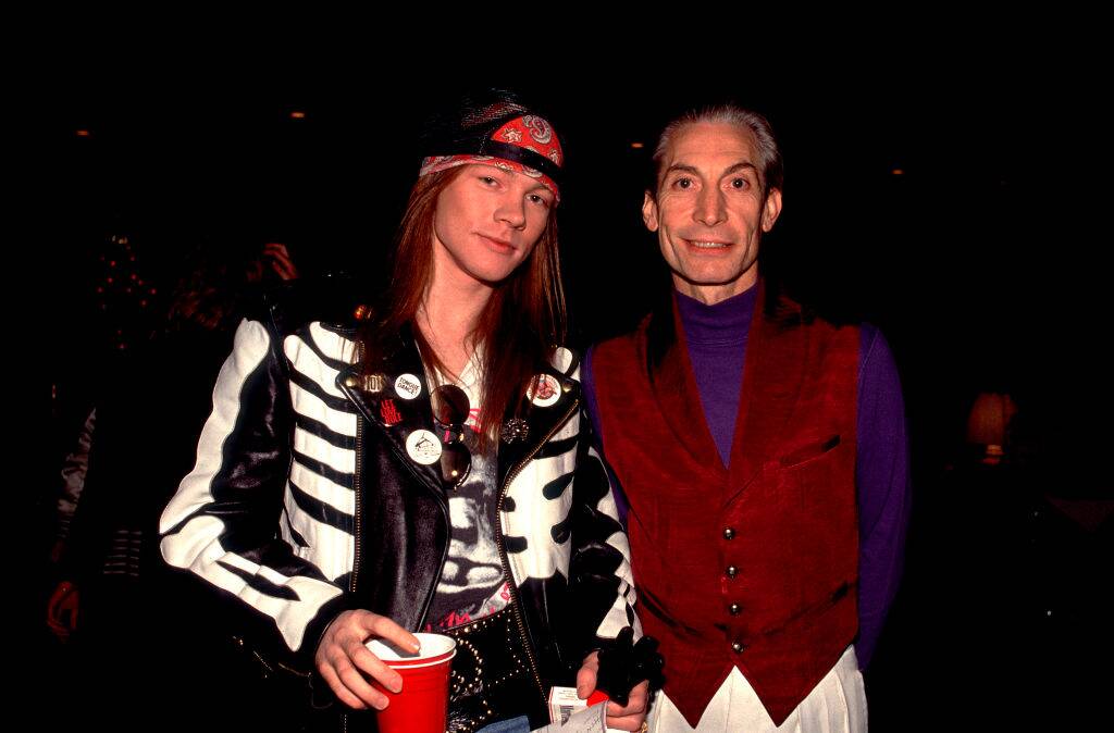 axl rose and charlie watts posing for a photo