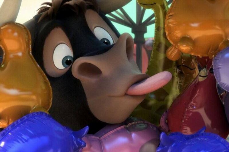 bull sticking tongue out among balloons in Ferdinand