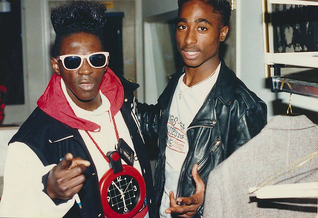 flavor flav and tupack shakur posing for a photo