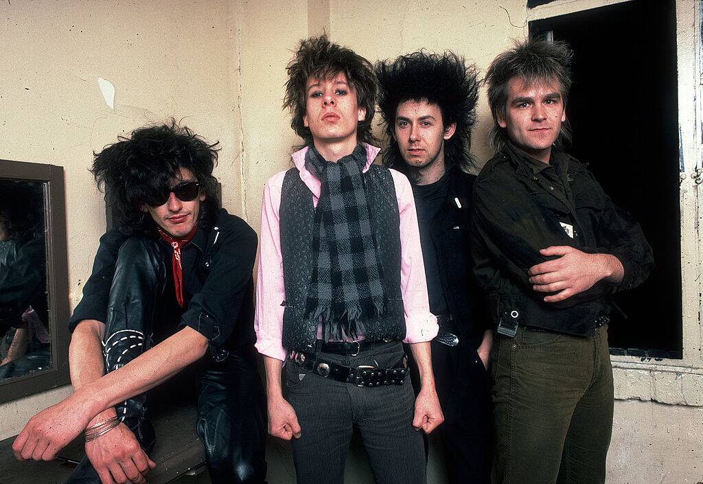 the alarm posing for a photo