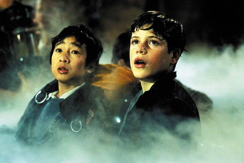 Sean Astin and Ke Huy Quan looking shocked as Mikey and Data in The Goonies