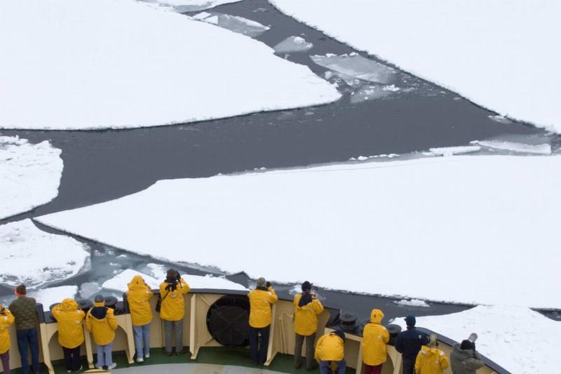 Tourists on Ice breaker, the Kapitan Khlebnikov, breaking through broken pack ice, Weddell Sea, Antarctica
