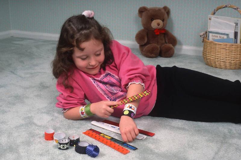 A little girl plays with her A little girl plays with her