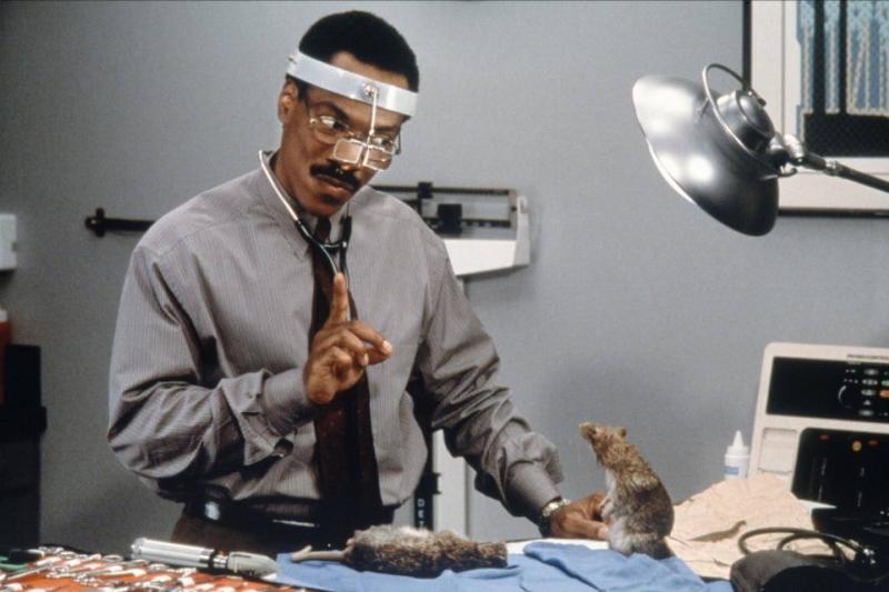Eddie Murphy examining rats as Dr. John Dolittle in Doctor Dolittle