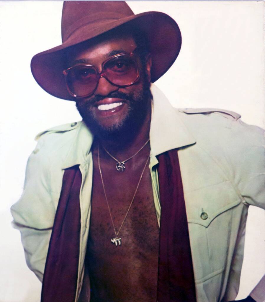 billy paul wearing a hat and sunglasses