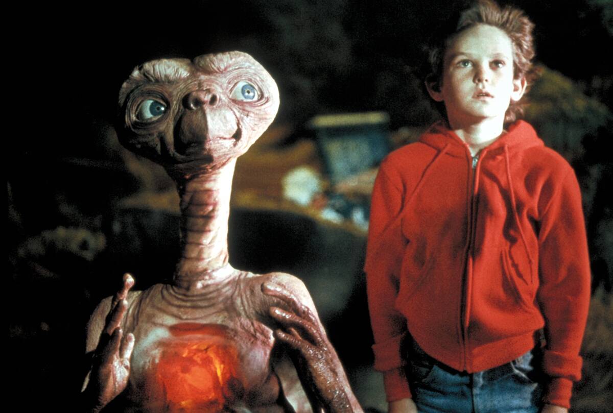 henry thomas with e.t. in e.t. the extra terrestrial