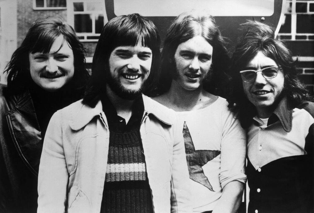 black and white photo of music group