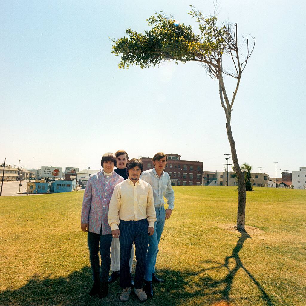 human beinz posing on a field