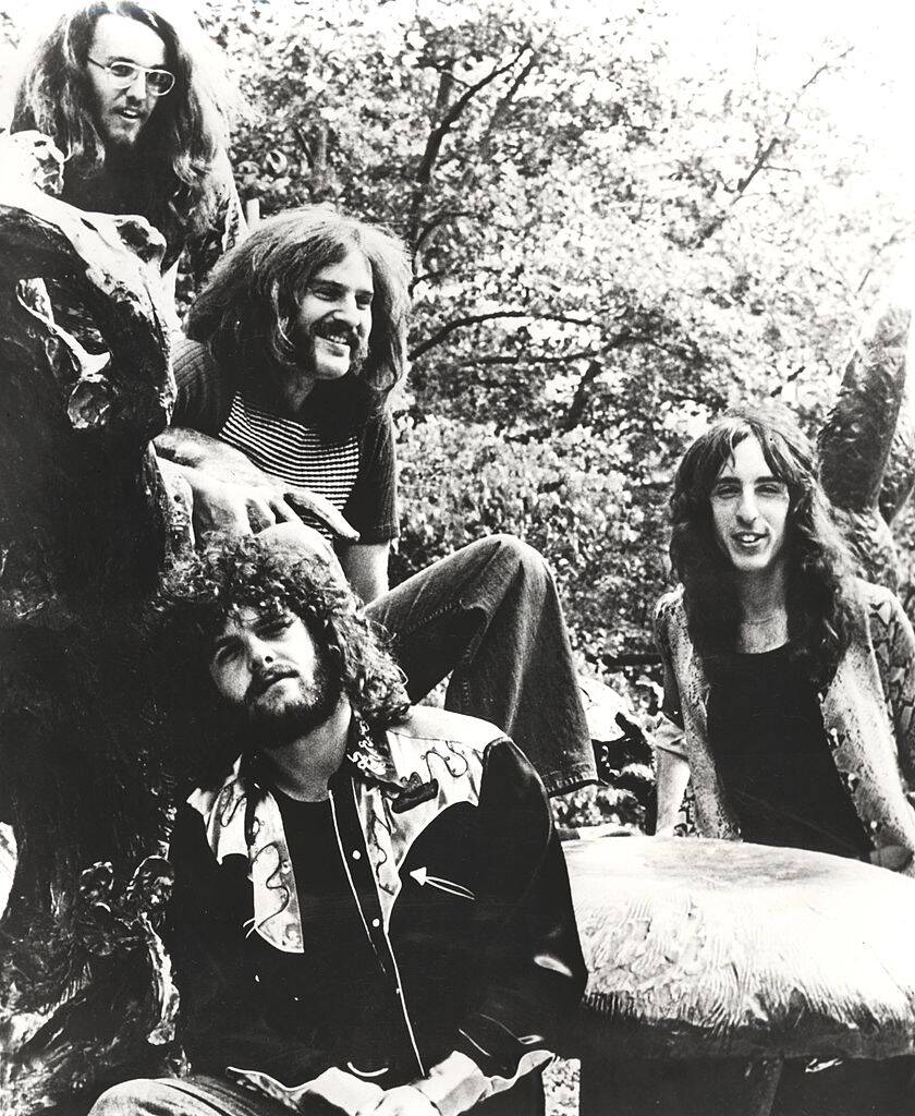 looking glass sitting by a tree