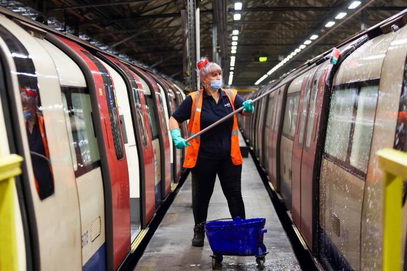 An employee cleans the outside of a train used on the Northern Line of  the London Underground network, at the Morden Traincare Centre, operated
 by Alstom SA, in London, U.K., on Tuesday, June 15, 2021.