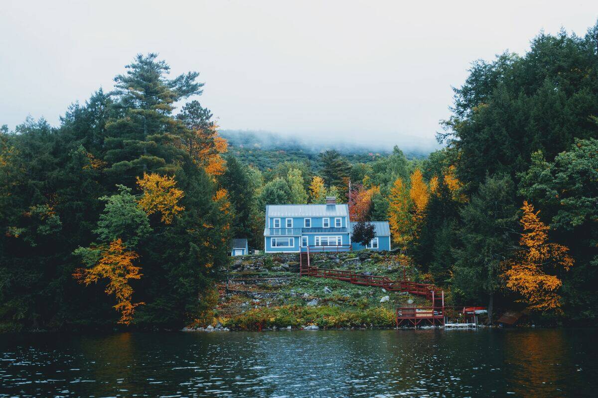 vermont house by a lake and trees