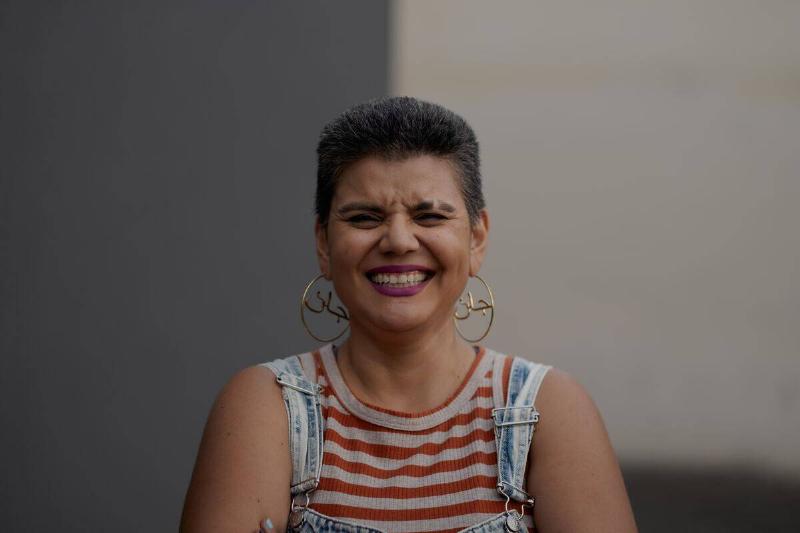 woman with short hair laughing