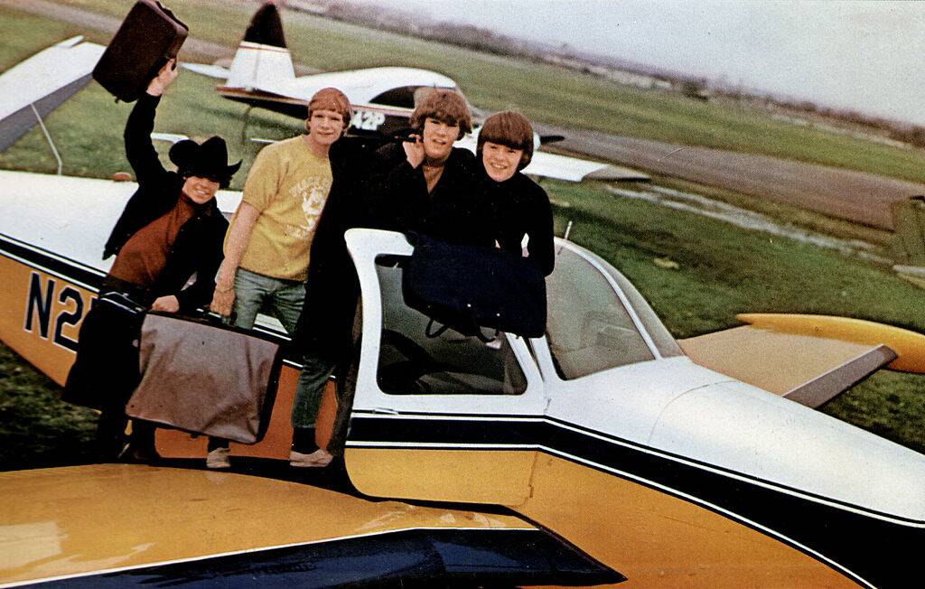 band sitting in a plane