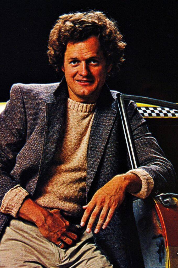 man with brown curly hair