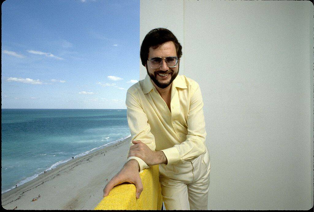 man in yellow shirt and sunglasses