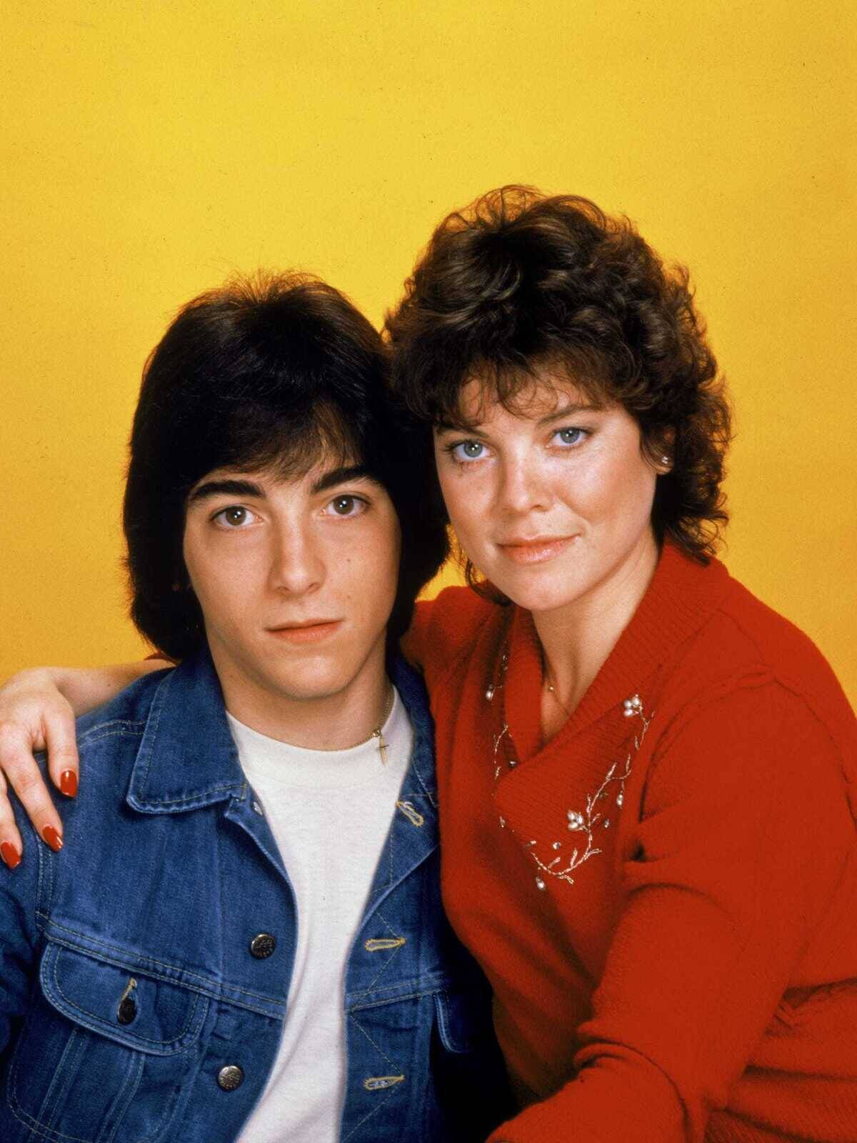 joanie loves chachi cast in front of orange background