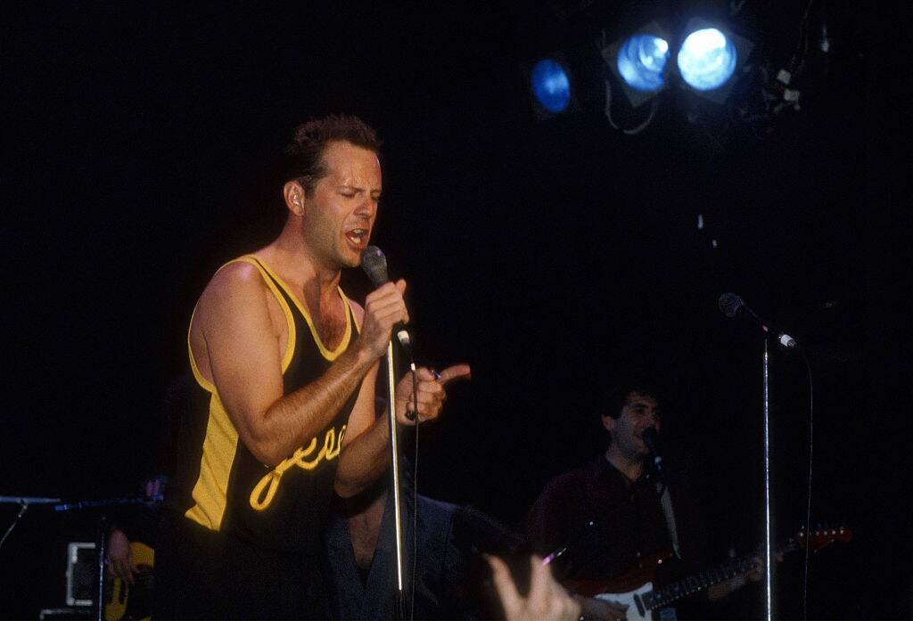 bruce willis on stage in the 80s