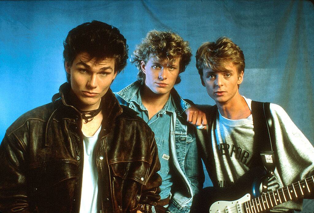 a-ha posing for a photo in the 80s