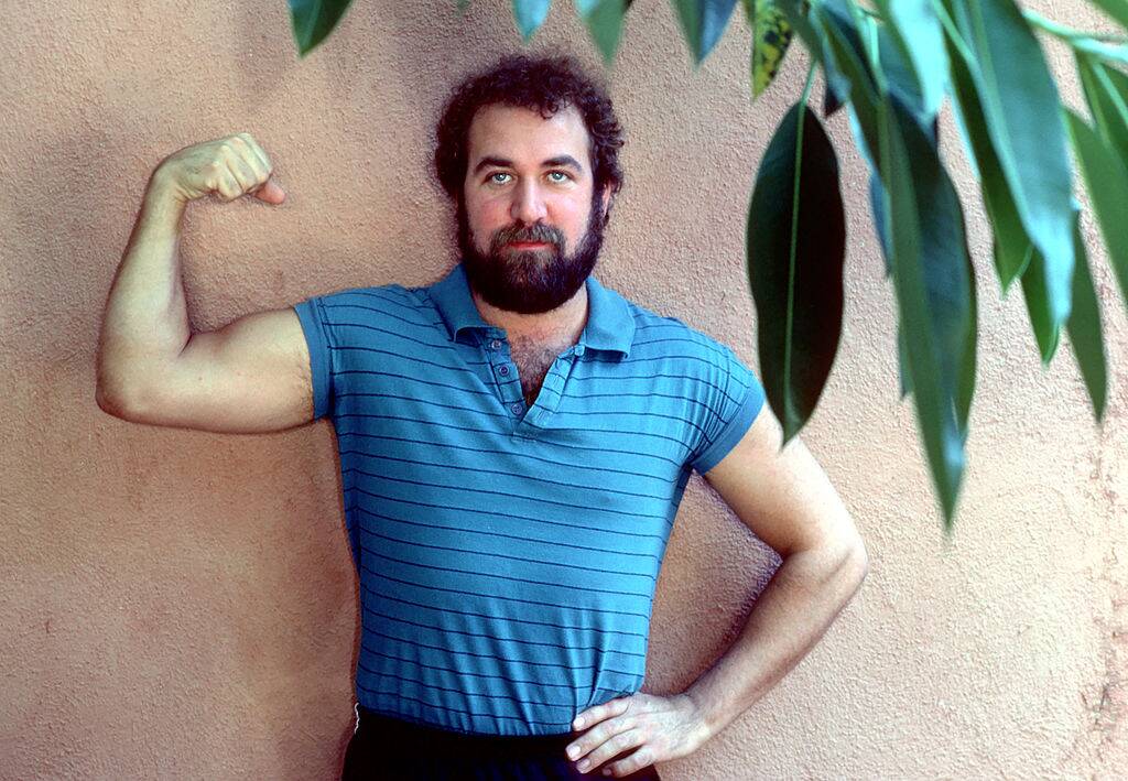 man flexing his muscles